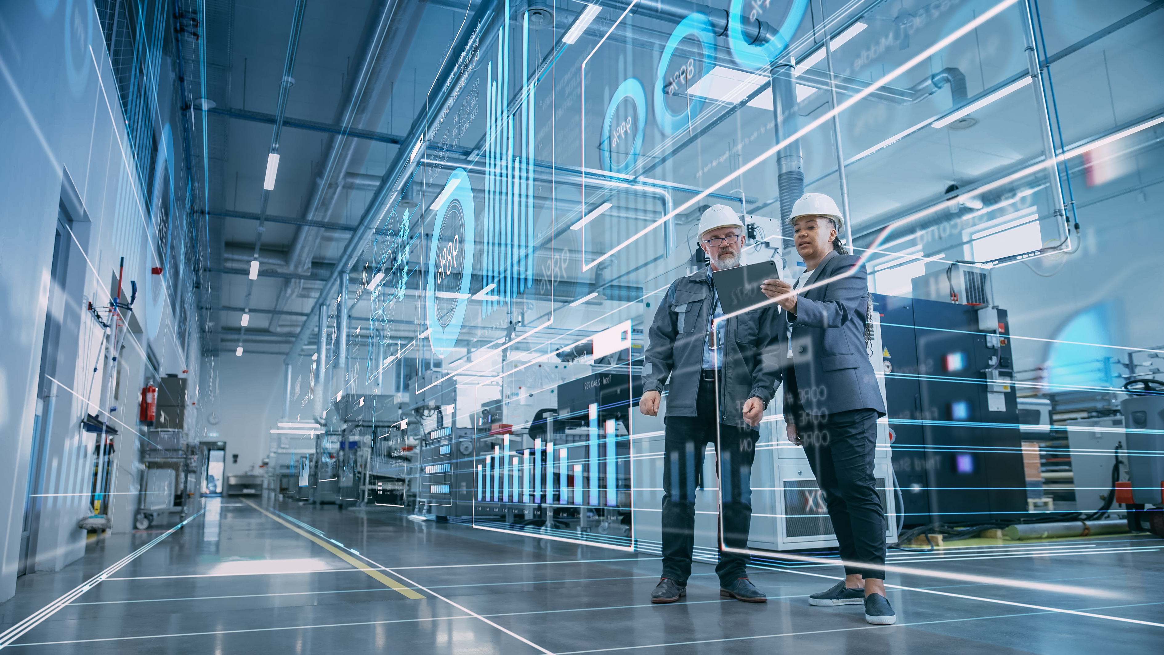 Smart factory floor with engineers using digital twin overlays